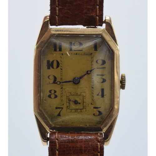 358 - 9ct gold gentleman's wristwatch on leather strap, 26mm wide. In ticking order.