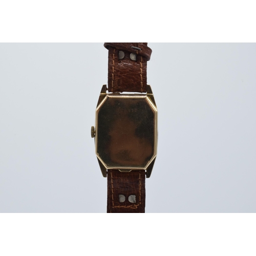 358 - 9ct gold gentleman's wristwatch on leather strap, 26mm wide. In ticking order.