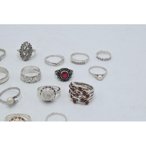 364 - A collection of silver rings of varying forms and sizes, 61.5 grams (16).