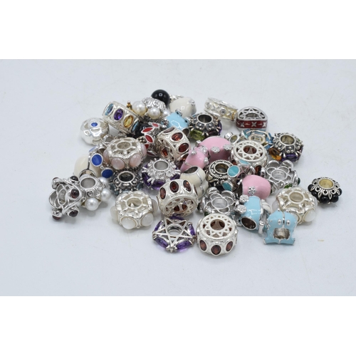 365 - A large collection of modern silver charms, 124.8 grams (Qty).