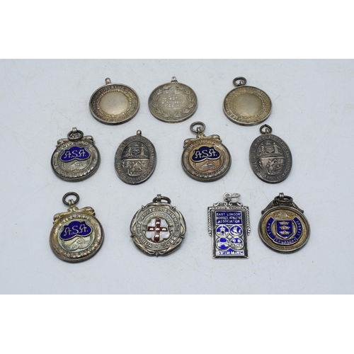 367 - A collection of silver fobs of varying sizes for differing organisations etc, 135.4 grams, (11).