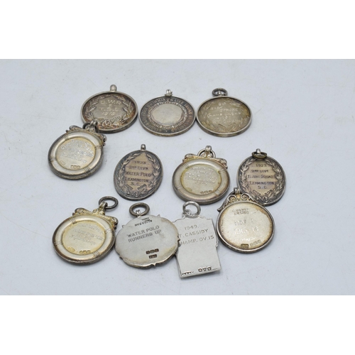 367 - A collection of silver fobs of varying sizes for differing organisations etc, 135.4 grams, (11).