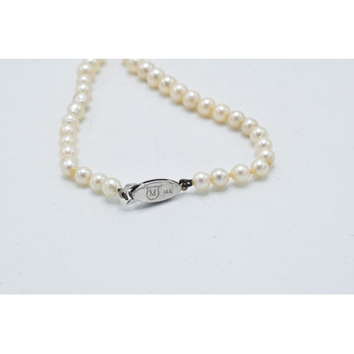 437 - Pearl necklace with 14ct gold strap, signed Mikimoto, circa 1950s, with graduated pearls from 4.2 to... 