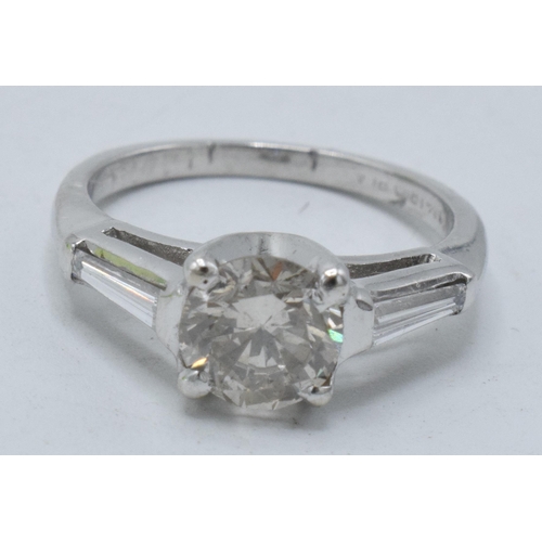 Platinum and diamond ladies ring, 0.95ct + 0.3ct (approx 1.25ct total of diamond), UK size J, 3.4 grams.