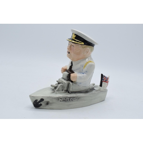 79 - Bairstow Manor Collectables comical model of Winston Churchill in a boat. 18cm tall.