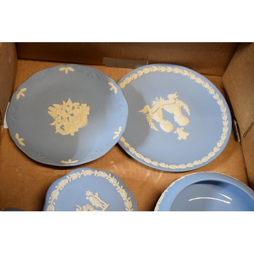 93A - A collection of Wedgwood light blue Jasperware to include trinkets, bud vases, gloss-interior bowl a... 