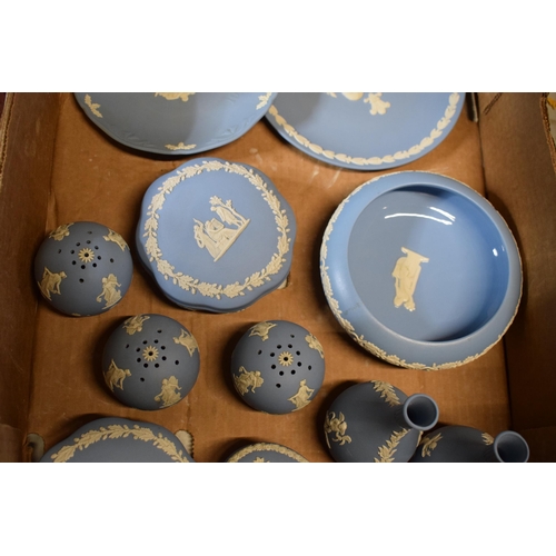 93A - A collection of Wedgwood light blue Jasperware to include trinkets, bud vases, gloss-interior bowl a... 