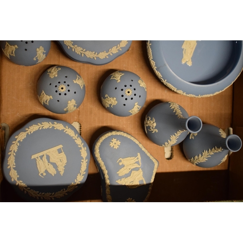 93A - A collection of Wedgwood light blue Jasperware to include trinkets, bud vases, gloss-interior bowl a... 