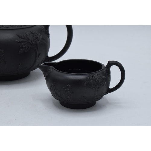 94 - Wedgwood Black Basalt tea set to include tea pot, creamer and lidded sugar (3).