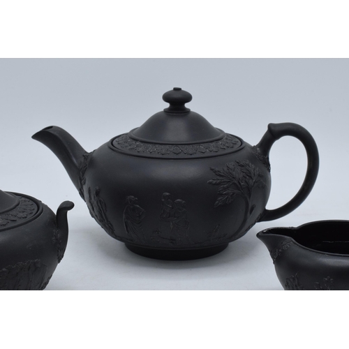 94 - Wedgwood Black Basalt tea set to include tea pot, creamer and lidded sugar (3).