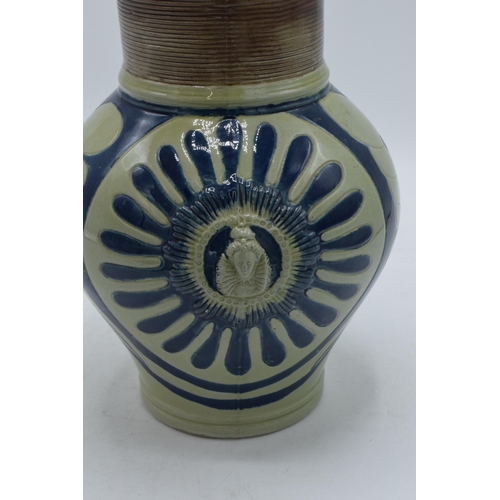 95 - Wedgwood stoneware jug imitating Westerwald with Queen's Head, 21cm tall.