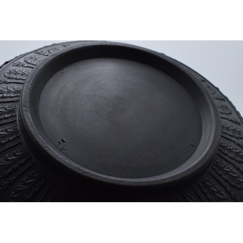 96 - Wedgwood black basalt footed fruit bowl decorated with Dancing Hours design, diameter 25cm.