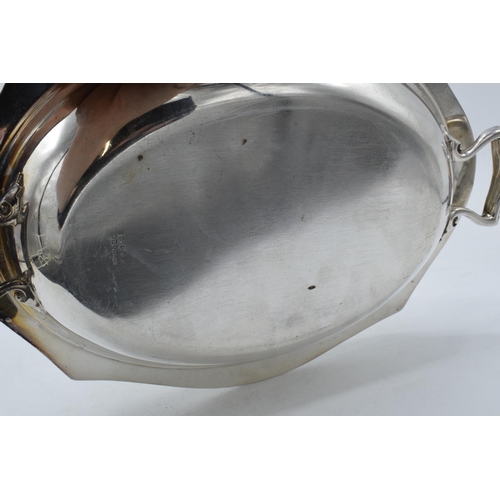 312 - Early 20th century silver plated entrée dish with kay handle to lid, 32cm long.