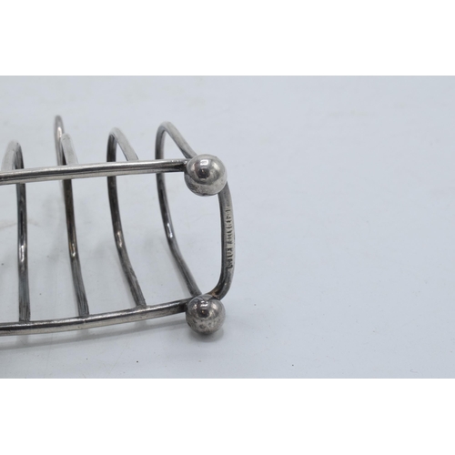 315 - Silver plated arched toast rack with 5 bars, 8cm long.