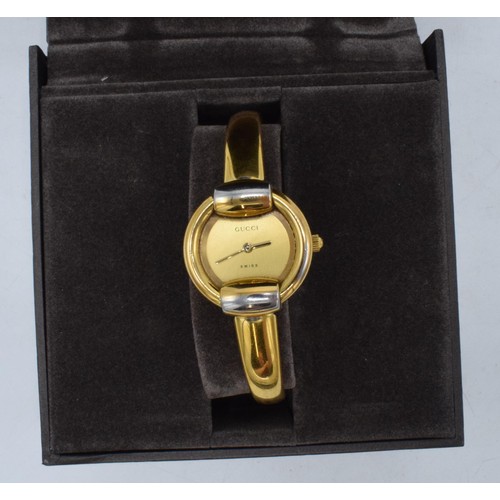 353 - Boxed Gucci gold-plated stainless steel lady's bangle watch 1400L, 26mm without bezel, untested.