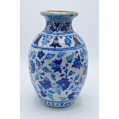 47 - A 19th century blue and white pottery Iznik or similar vase with crackle glaze effect. 25cm tall.