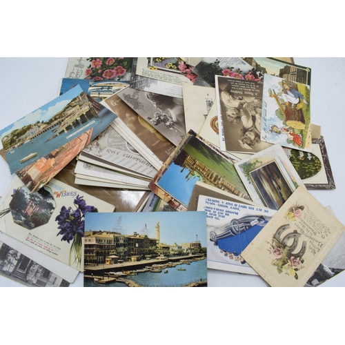 305 - A mixed collection of postcards to date from late 19th century with later examples too featuring a m... 