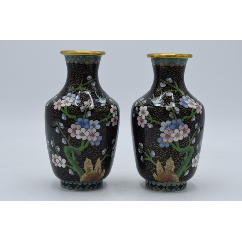 241 - A pair of Japanese cloisonne vases with floral decoration on a black background, 15.5cm tall,