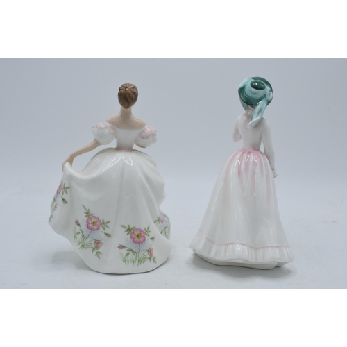 134 - A pair of Royal Doulton lady figures to include Julia HN2706 and Lucy HN3653 (2).