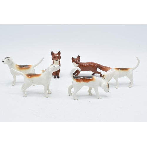 158 - A collection of Beswick to include 4 foxhounds and 2 foxes (6).