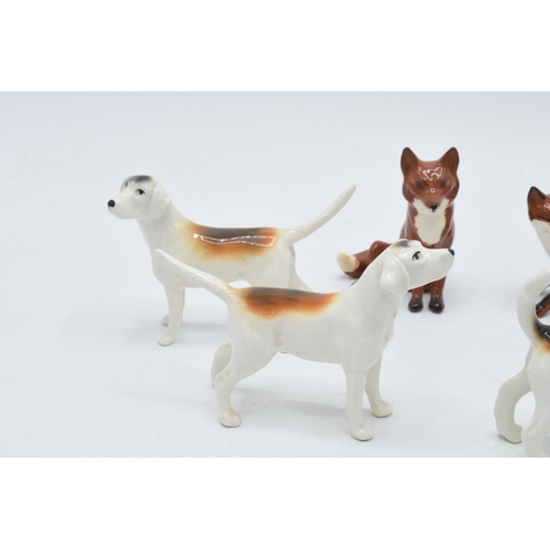 158 - A collection of Beswick to include 4 foxhounds and 2 foxes (6).