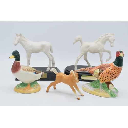 160 - A collection of Beswick to include matte white Adventure and Springtime, palomino foal and 2 John Be... 