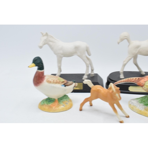 160 - A collection of Beswick to include matte white Adventure and Springtime, palomino foal and 2 John Be... 