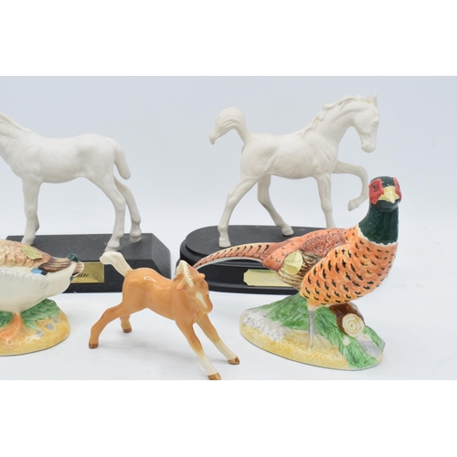 160 - A collection of Beswick to include matte white Adventure and Springtime, palomino foal and 2 John Be... 