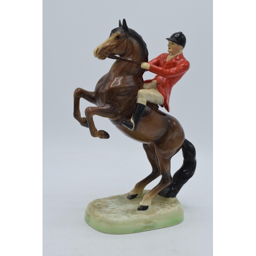 162 - Beswick rearing huntsman with red jacket 868 together with 2 foxhounds (3).