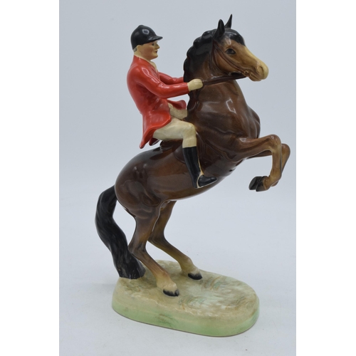 162 - Beswick rearing huntsman with red jacket 868 together with 2 foxhounds (3).