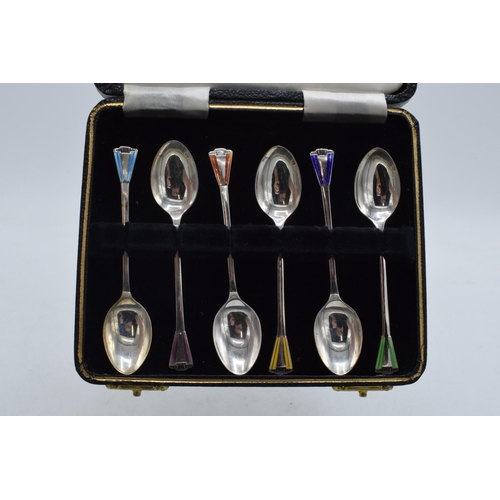 204 - A cased set of 6 silver teaspoons with coloured enamel decoration, 38.3 grams / 1.23 oz. Birmingham ... 