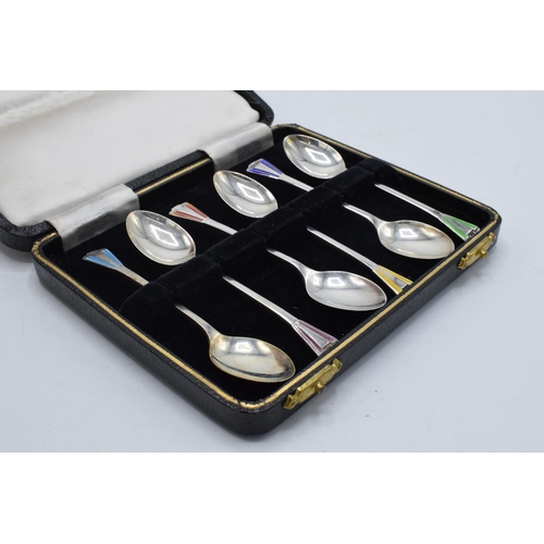 204 - A cased set of 6 silver teaspoons with coloured enamel decoration, 38.3 grams / 1.23 oz. Birmingham ... 