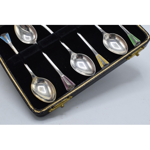 204 - A cased set of 6 silver teaspoons with coloured enamel decoration, 38.3 grams / 1.23 oz. Birmingham ... 