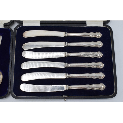 205 - A set of 6 silver cased tea spoons, 53.8 grams, together with a cased set of 6 silver-handled knives... 