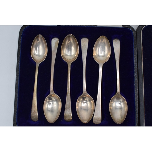 205 - A set of 6 silver cased tea spoons, 53.8 grams, together with a cased set of 6 silver-handled knives... 