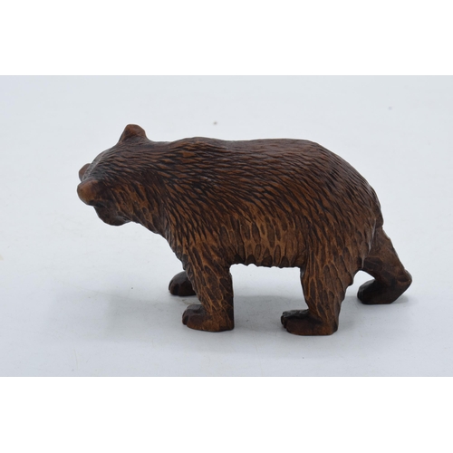 249 - Early 20th century wooden Black Forest carving of a stalking bear, 12cm long.