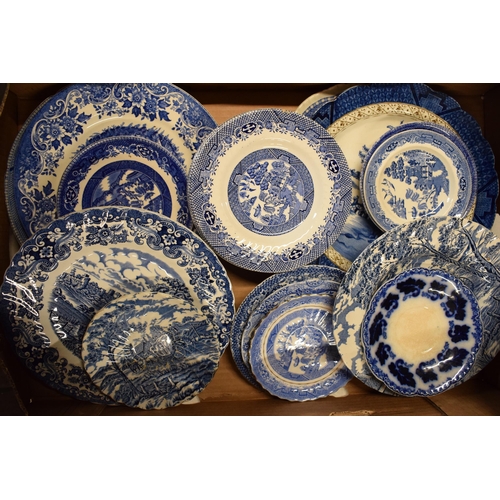 25 - A large collection of 19th century and later blue and white pottery to include plates, bowls, dishes... 