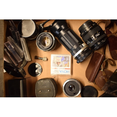 268 - A collection of camera equipment to include lenses such as Canon 50mm, Nikon 52mm, CF Auto Teleplus ... 