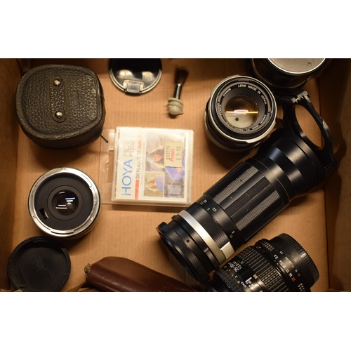 268 - A collection of camera equipment to include lenses such as Canon 50mm, Nikon 52mm, CF Auto Teleplus ... 