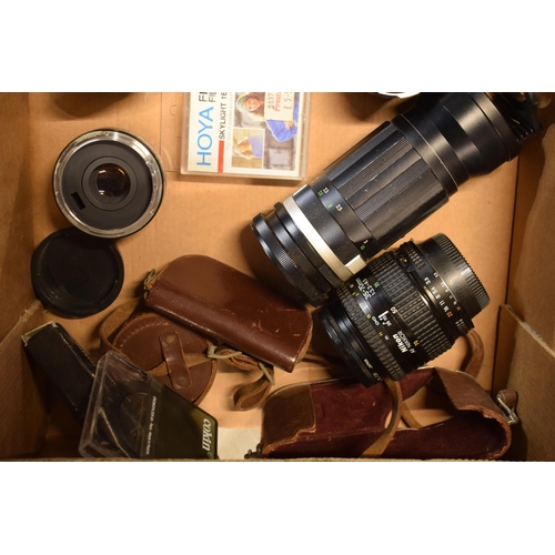 268 - A collection of camera equipment to include lenses such as Canon 50mm, Nikon 52mm, CF Auto Teleplus ... 