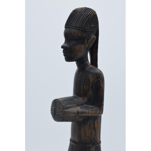 280 - 20th century African tribal carving of a figure, 35cm tall.