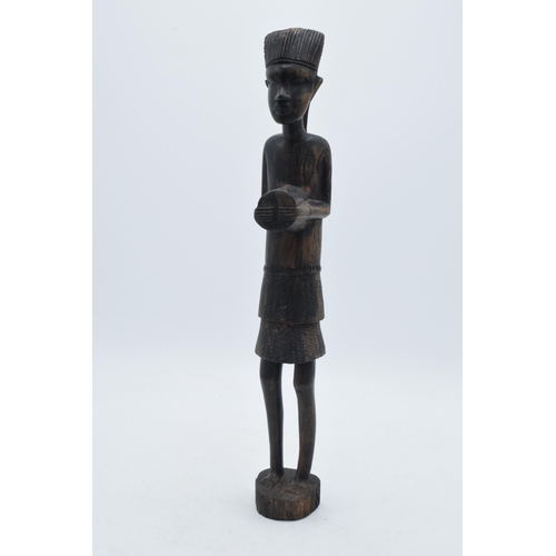 280 - 20th century African tribal carving of a figure, 35cm tall.