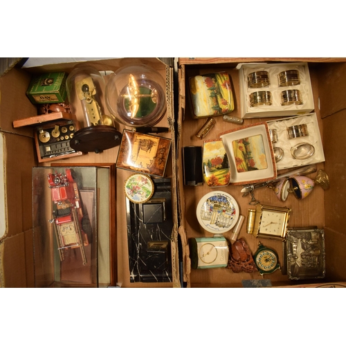 295 - A mixed collection of items to include model vehicles, clocks, desk tidy, sticks and other items (Qt... 