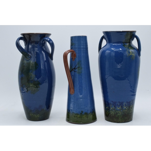 37 - A trio of Longpark Torquay Ware vases with each decorated with a parrot amongst tree branches, one v... 