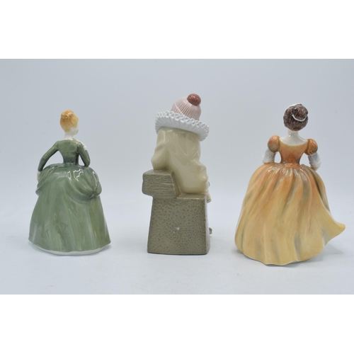 42 - Lladro figure of a jester together with a pair of Francesca figures (3).