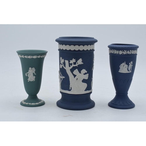 77 - A trio of Wedgwood Jasperware items to include dark blue spill vase, trumpet vase and one similar in... 