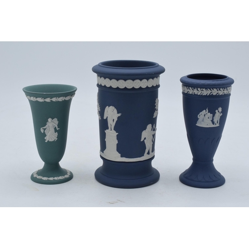 77 - A trio of Wedgwood Jasperware items to include dark blue spill vase, trumpet vase and one similar in... 