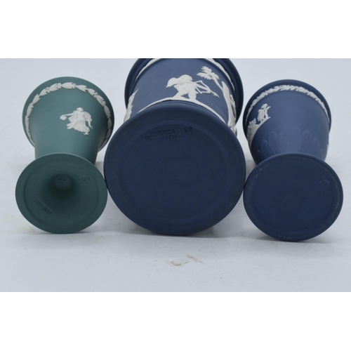 77 - A trio of Wedgwood Jasperware items to include dark blue spill vase, trumpet vase and one similar in... 