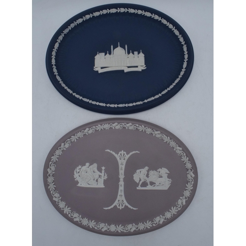 78 - A pair of Wedgwood Jasperware oval plaques to include lilac example and dark blue 'Royal Pavilion Br... 