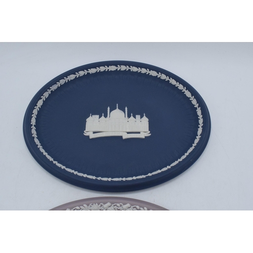 78 - A pair of Wedgwood Jasperware oval plaques to include lilac example and dark blue 'Royal Pavilion Br... 